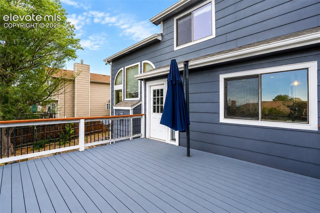 Image 35 of 43: Upper deck with walk out from kitchen/living room