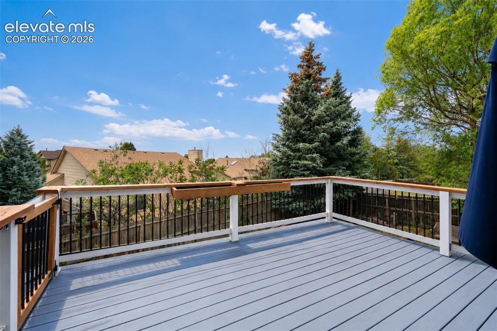 Image 36 of 43: Upper deck with walk out from kitchen/living room