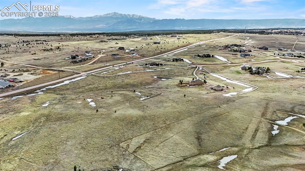 Image 19 of 23: Drone / aerial view with mountain/ pikes peak view