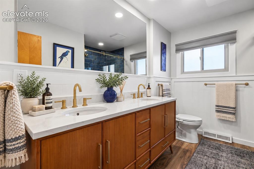 Image 16 of 36: Stunning remodeled bath featuring custom artisan tile imported from Spain a