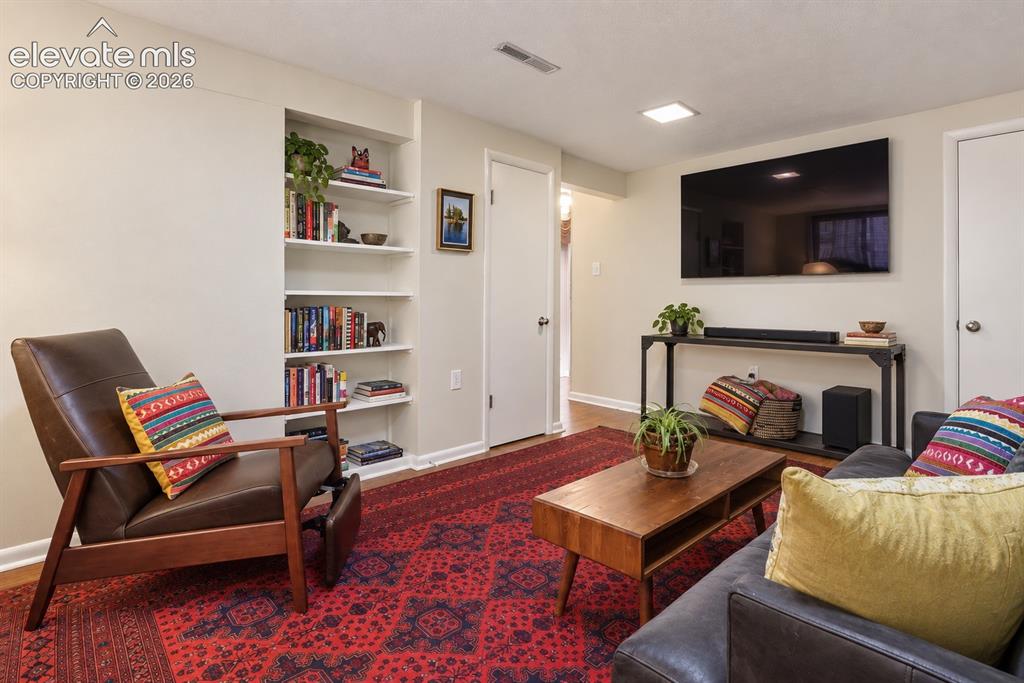 Image 25 of 36: Flexible lower-level space perfect for a second living area, guest room, ho