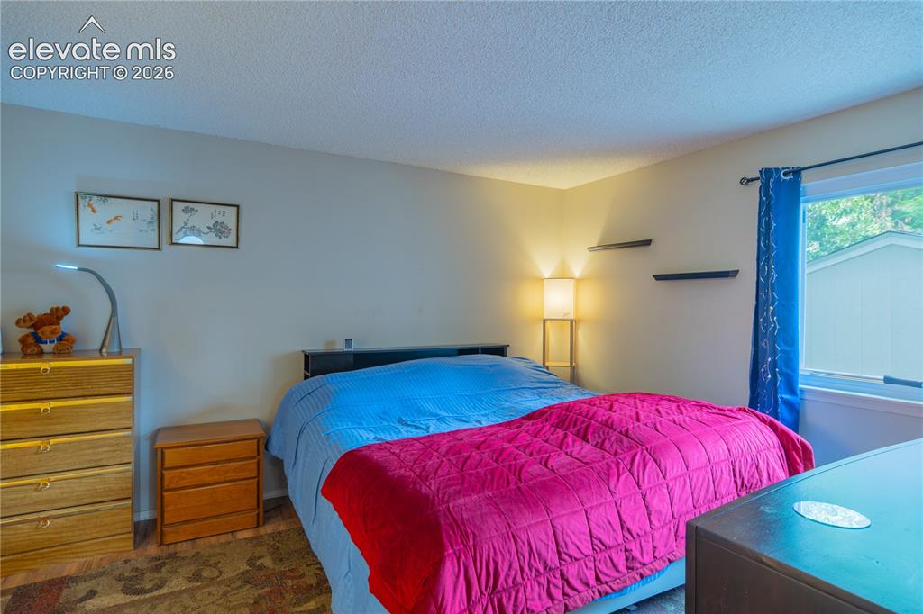 Image 13 of 42: Primary main floor bedroom