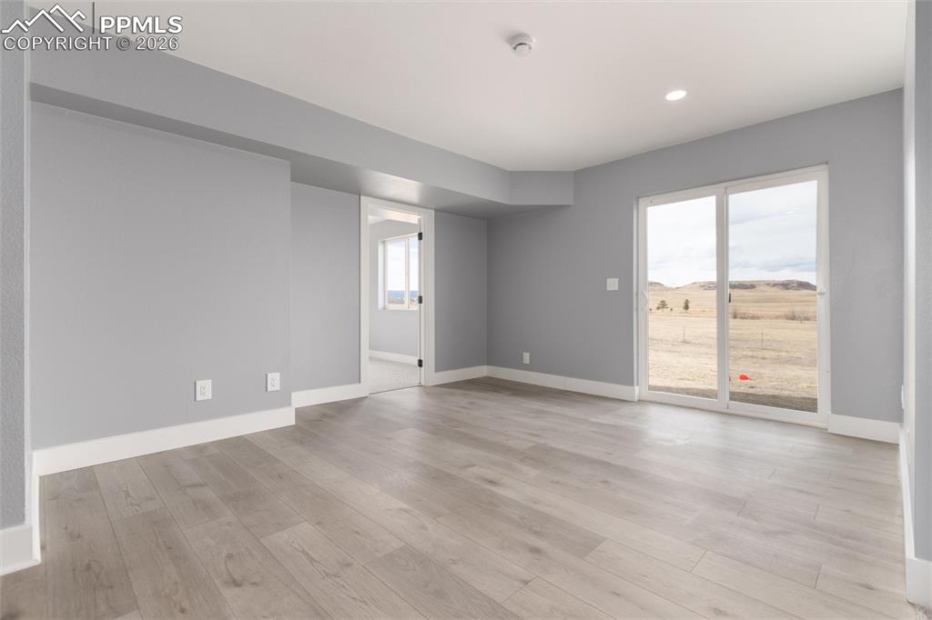 Image 35 of 50: Beautiful northeast views from guest bedroom.