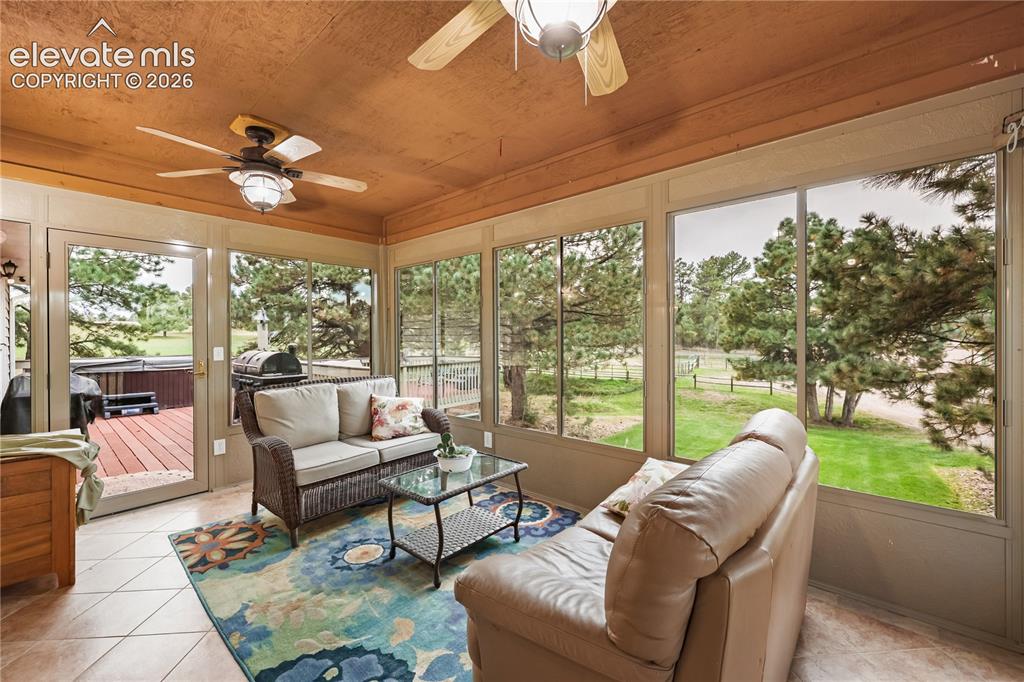 Image 10 of 50: Sunroom that overlooks the horses.