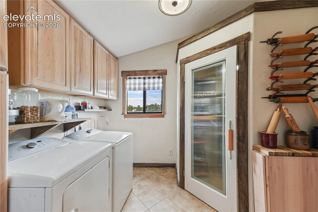 Image 15 of 50: Laundry room with utility sink! Pantry!