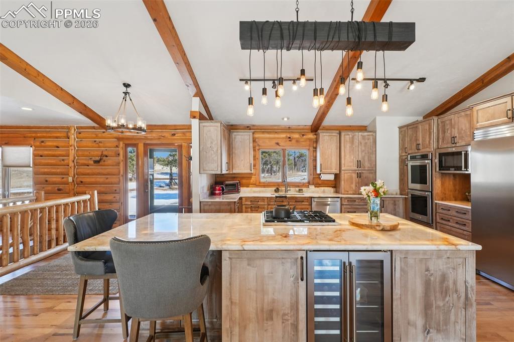 Image 5 of 40: Alder custom cabinets, quartzite countertops, huge lighted island