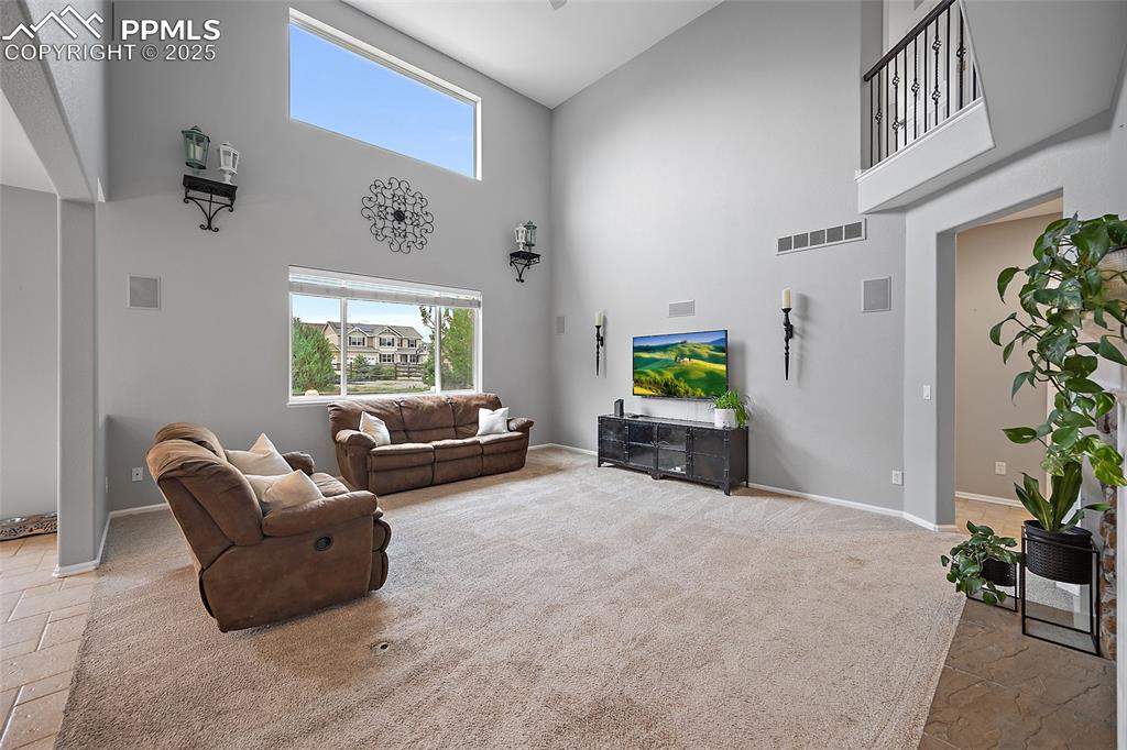 Image 17 of 50: Living room open to the kitchen. 