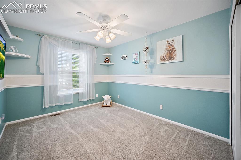 Image 32 of 50: Upper-level bedroom. 