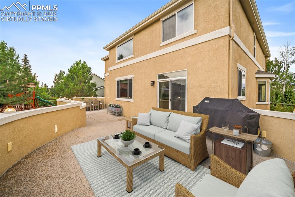 Image 34 of 50: virtually staged two layered patio. Upper and lower. 