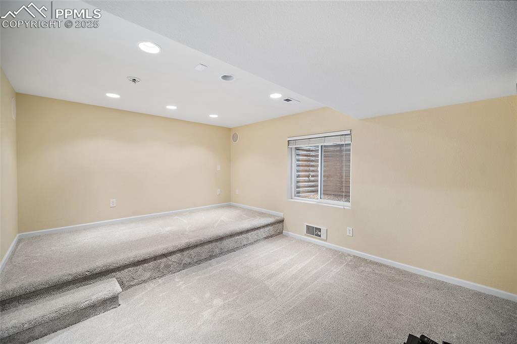 Image 40 of 50: Lower-level media room. 