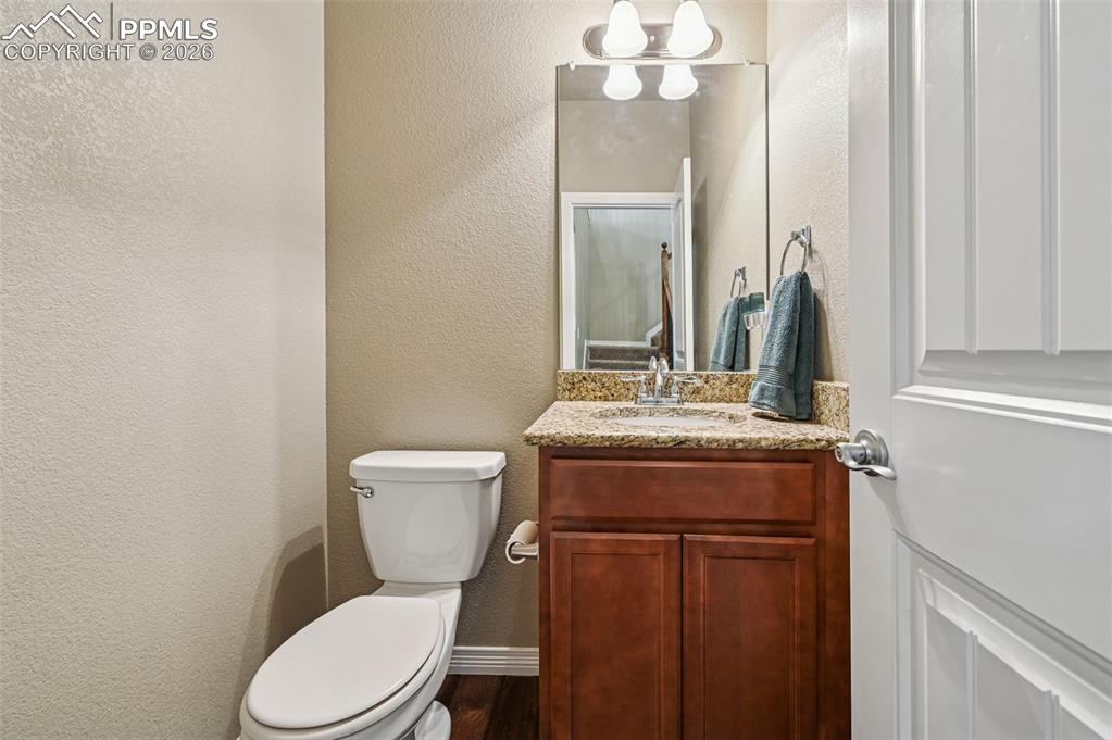 Image 19 of 38: Bathroom featuring vanity and a textured wall
