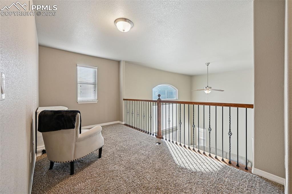 Image 20 of 38: Sitting room featuring carpet flooring and a textured ceiling