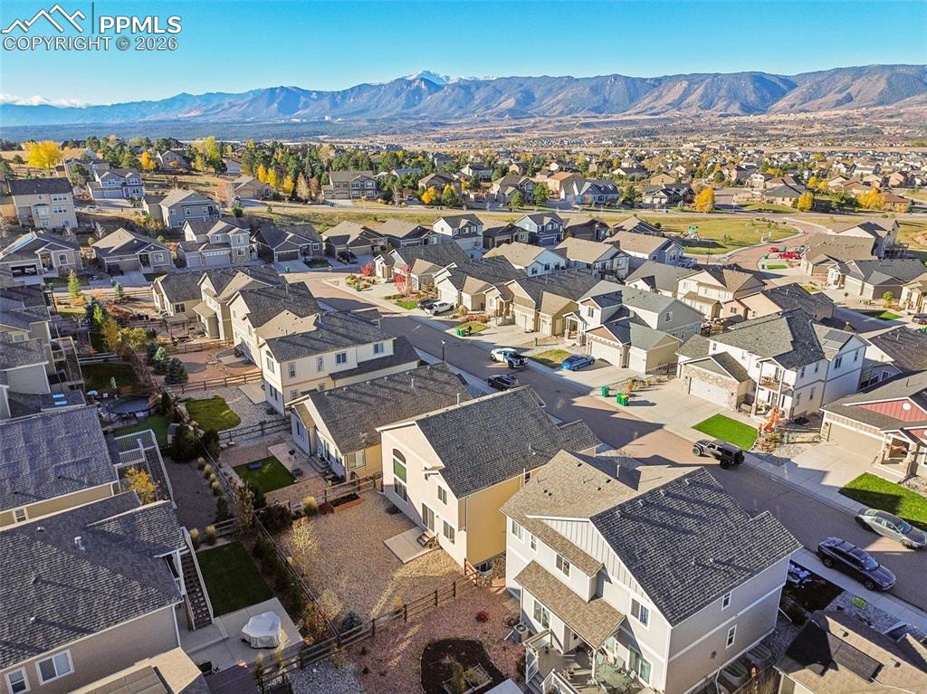 Image 7 of 38: Drone / aerial view of a mountain backdrop