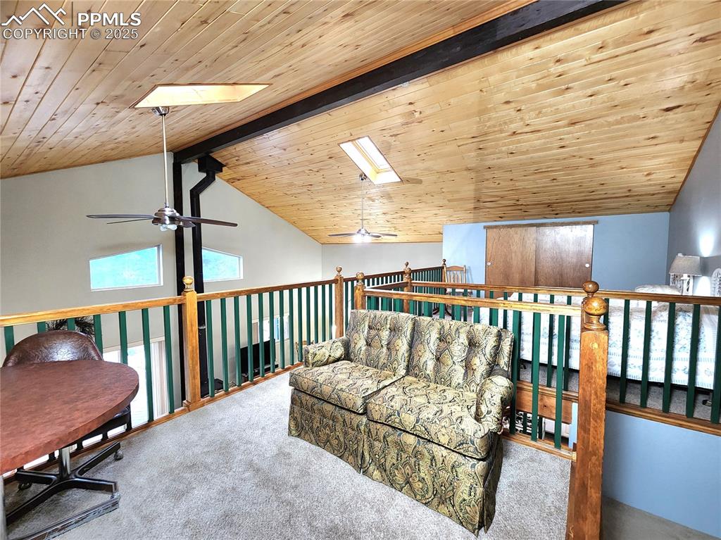 Image 25 of 50: Loft is spacious with room for sitting area and sleeping area, and has 2 cl