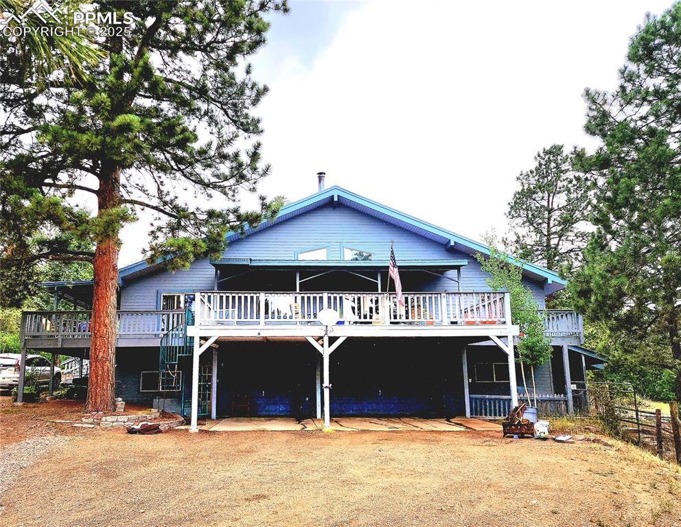 Image 42 of 50: 3 car attached garage is located under the front deck