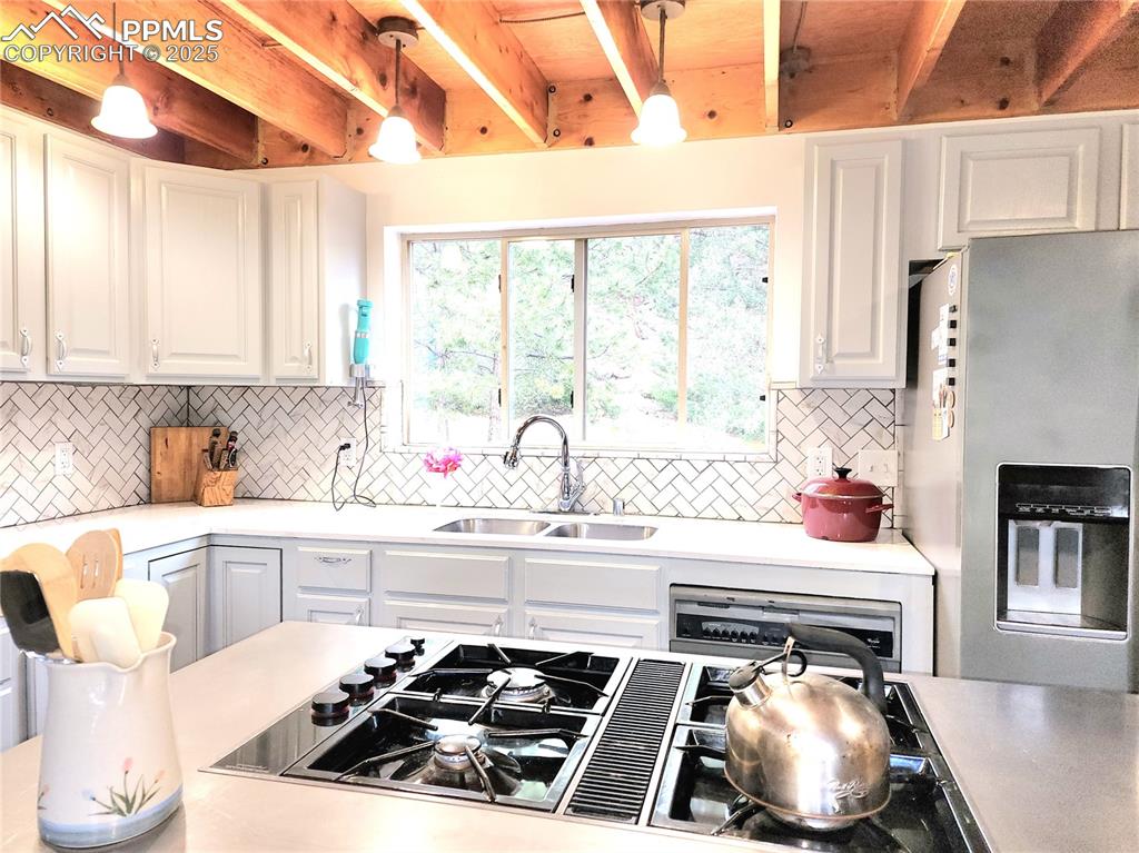 Image 8 of 50: Well appointed kitchen opens to the main living areas and is a cooks dream