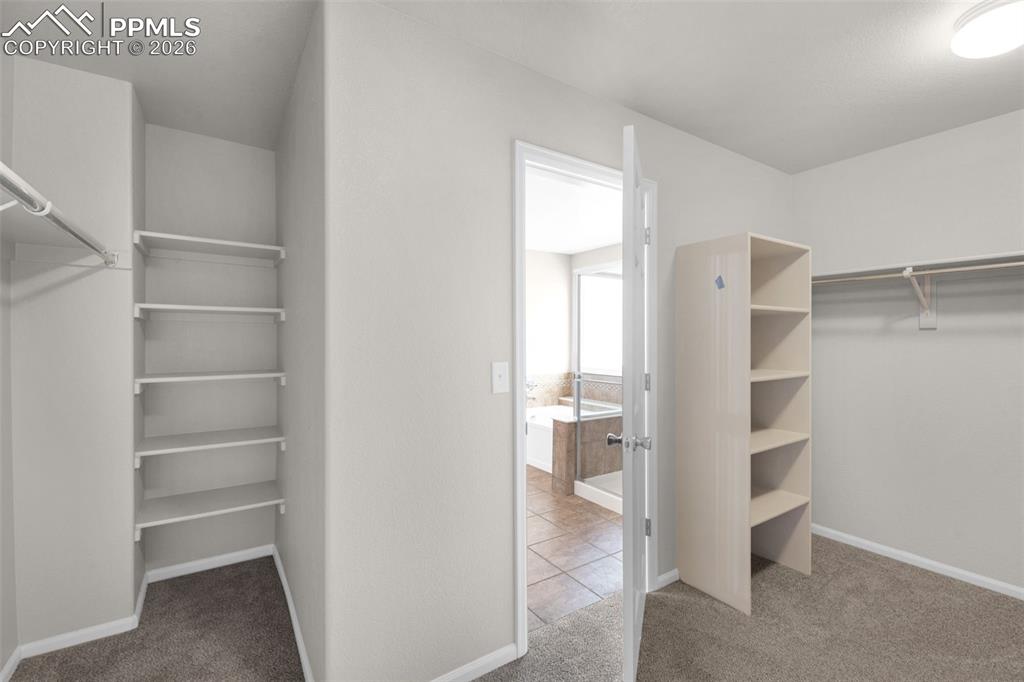 Image 22 of 50: Walk In Closet