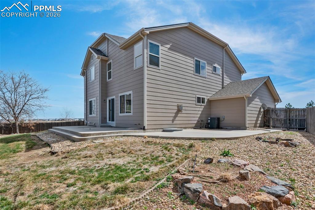 Image 40 of 50: Fenced Back Yard