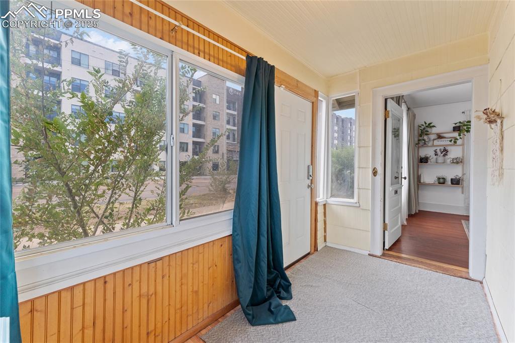 Image 3 of 33: Sun room inside the front door