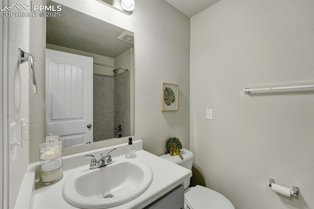 Image 20 of 25: There is another full bathroom on the upper level.