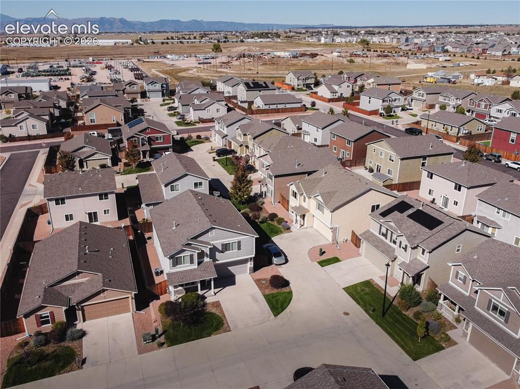 Image 35 of 35: Residential development featuring multiple single-family homes with pitched