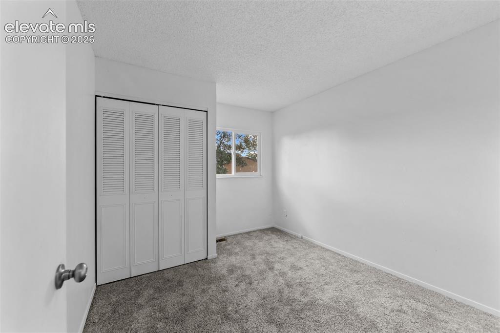 Image 9 of 20: Room featuring neutral carpeting and white painted walls