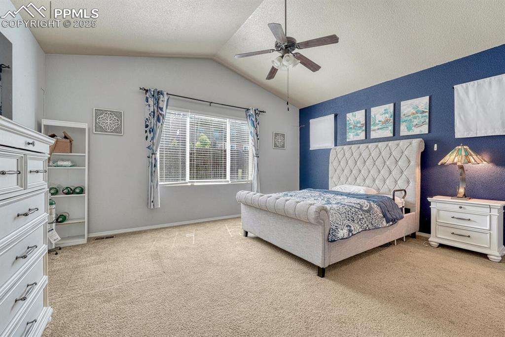 Image 16 of 41: Discover the peaceful ambiance of the Primary Bedroom, where a light-colore