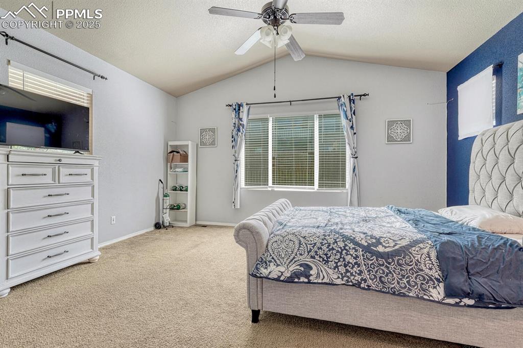 Image 18 of 41: Discover the peaceful ambiance of the Primary Bedroom, where a light-colore