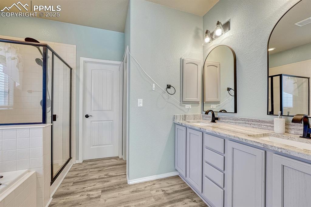 Image 19 of 41: Indulge in the luxury of this exquisite primary bathroom, featuring a refre