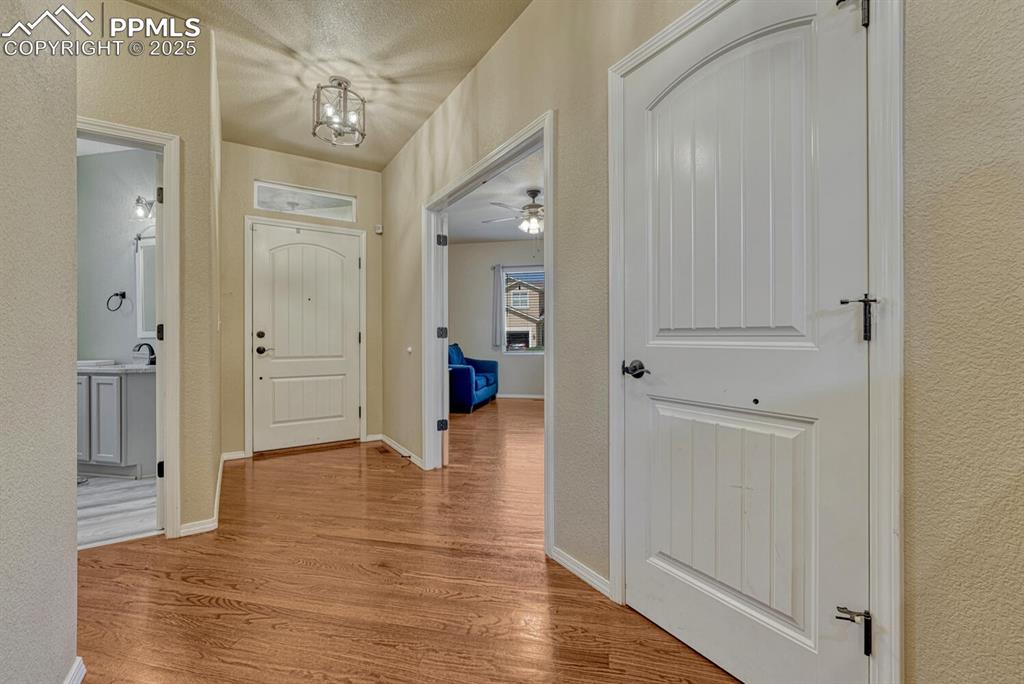 Image 2 of 41: Step into the foyer entrance, where the combination of textured walls and l