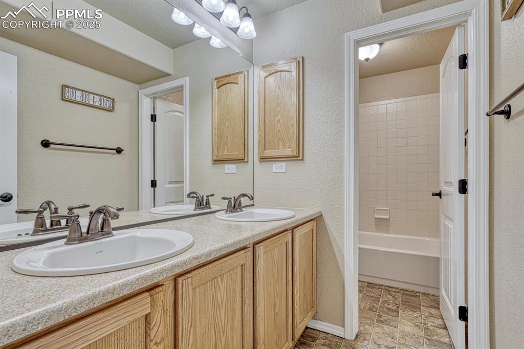 Image 29 of 41: Step into a bathroom that expertly blends style and functionality, featurin