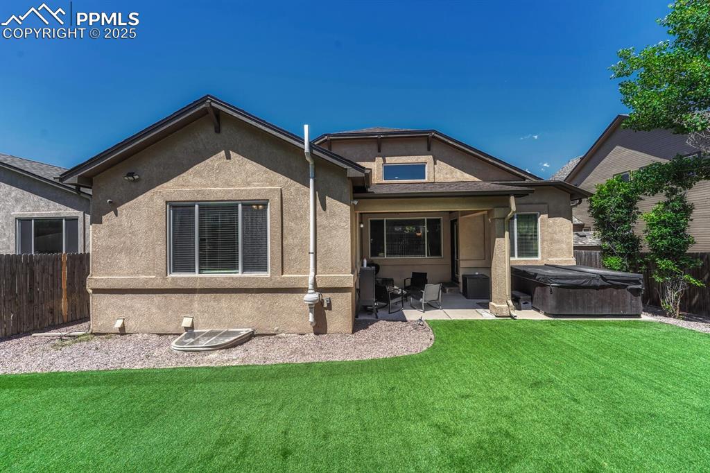 Image 33 of 41: The back of the house presents a tranquil atmosphere, with amenities like a
