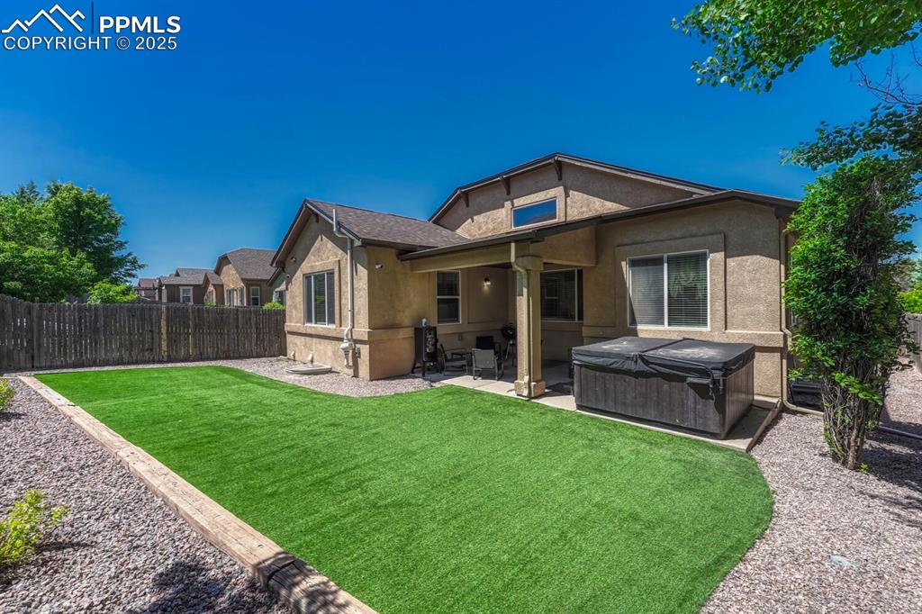 Image 34 of 41: The back of the house presents a tranquil atmosphere, with amenities like a