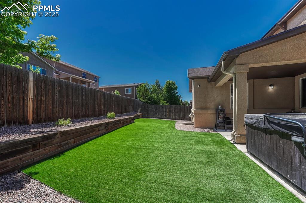 Image 35 of 41: The back of the house presents a tranquil atmosphere, with amenities like a