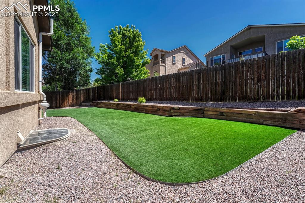 Image 37 of 41: The back of the house presents a tranquil atmosphere, with amenities like a
