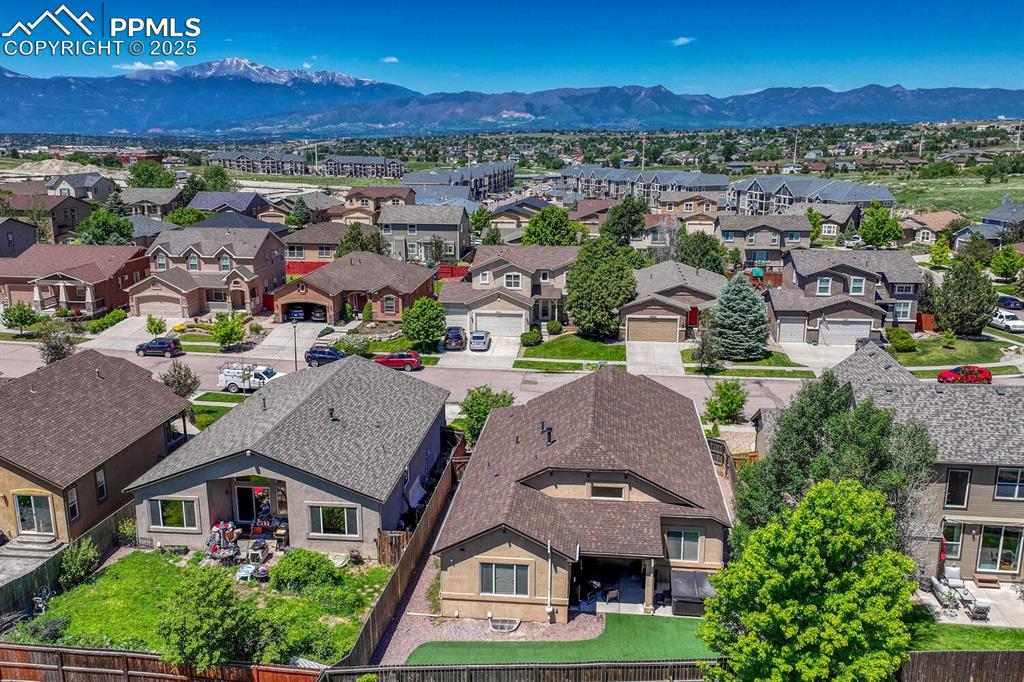 Image 38 of 41: A breathtaking aerial view of a thriving suburban area set against the stun