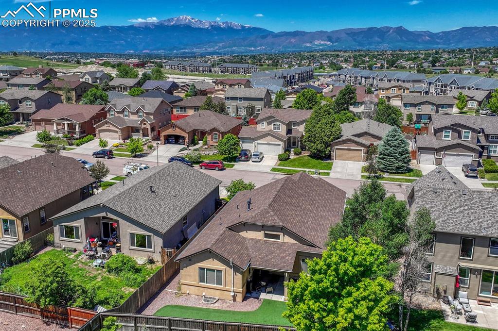Image 39 of 41: A breathtaking aerial view of a thriving suburban area set against the stun