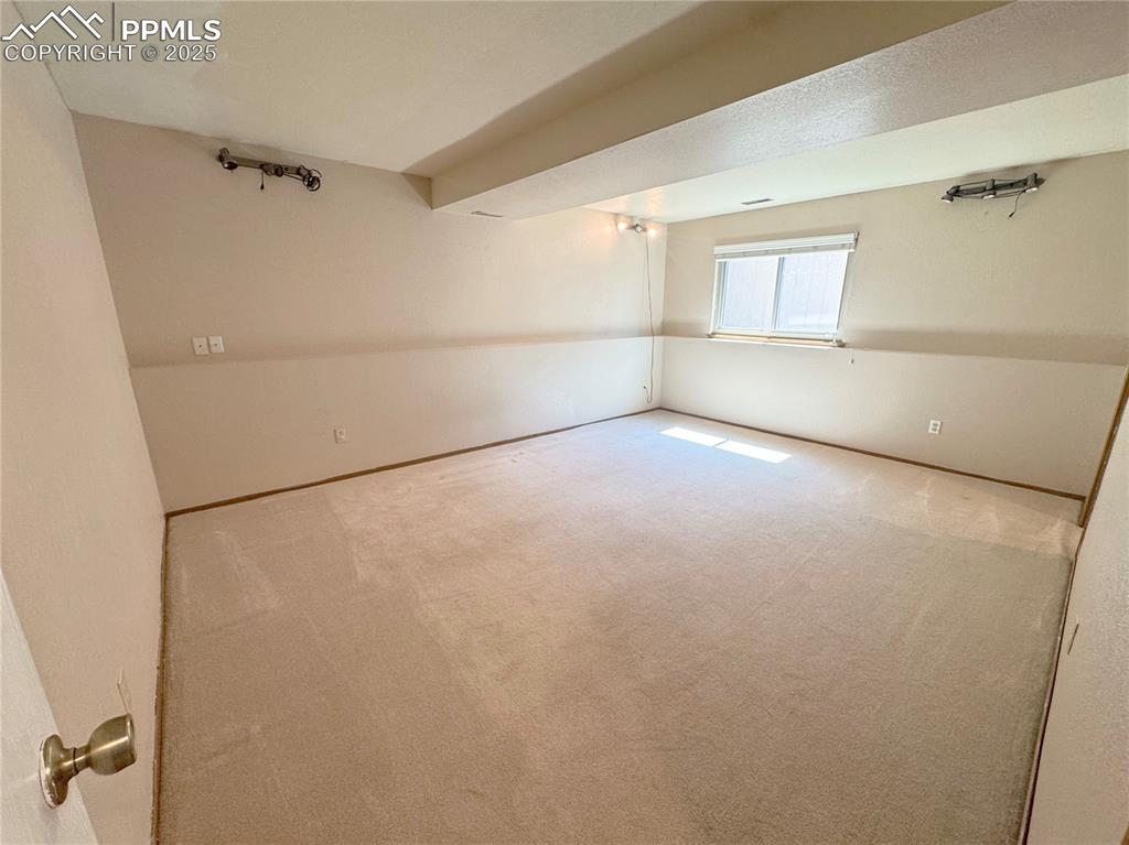 Image 17 of 28: View of carpeted empty room