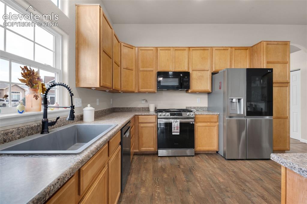 Image 11 of 50: New Appliances and Kitchen sink. Did you see the gas range?