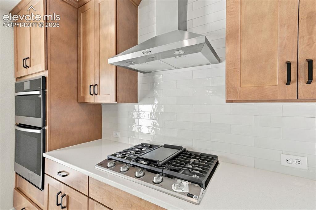 Image 17 of 49: Modern kitchen featuring stainless steel appliances, light maple cabinets w
