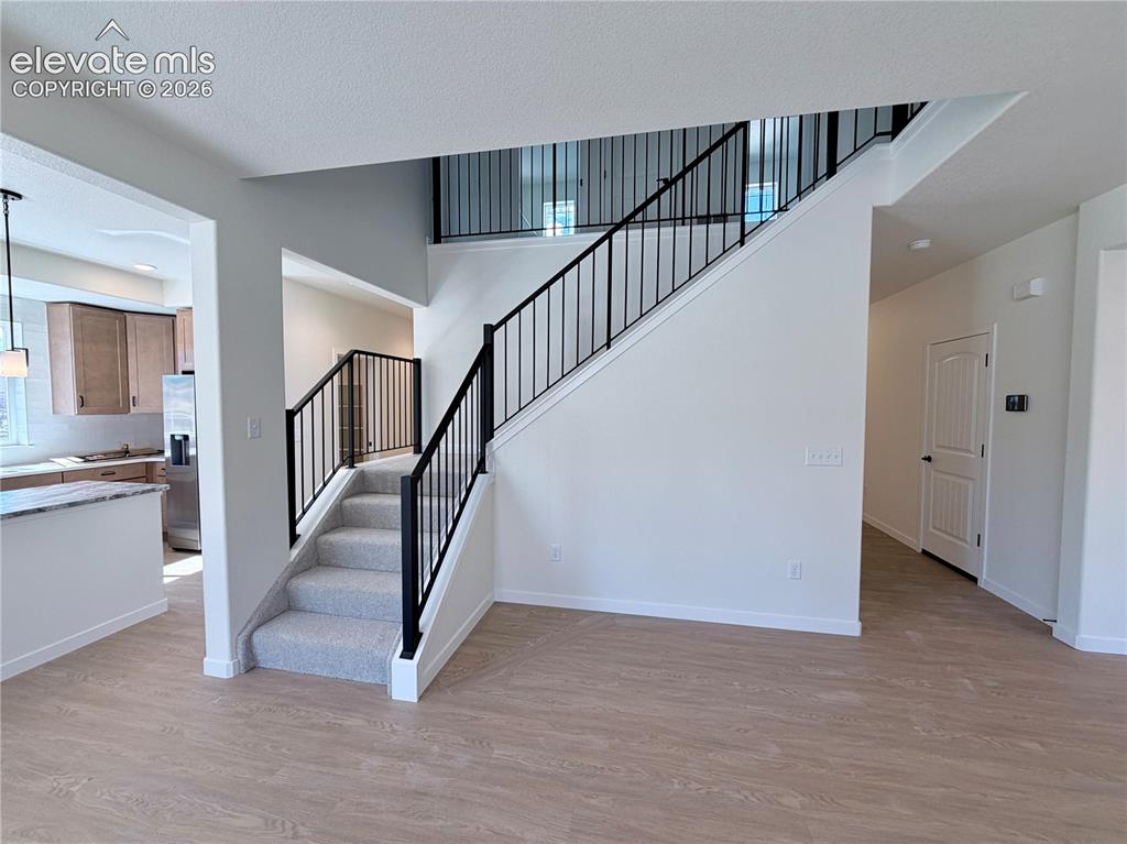 Image 18 of 46: Stairs to Upper Level