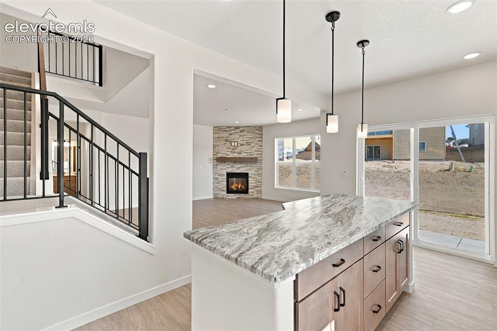 Image 20 of 49: Modern kitchen featuring stainless steel appliances, light maple cabinets w