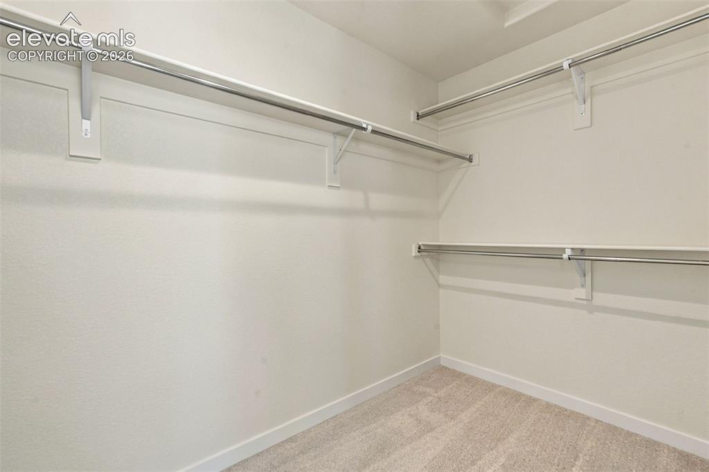 Image 30 of 49: Primary Bedroom Walk-in Closet