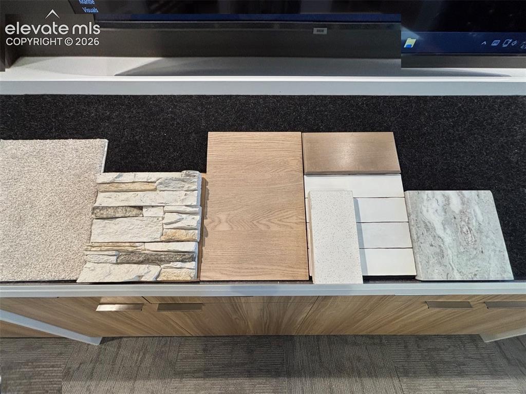 Image 4 of 8: Carpet, Fireplace Stone, LVP, and Kitchen Finishes