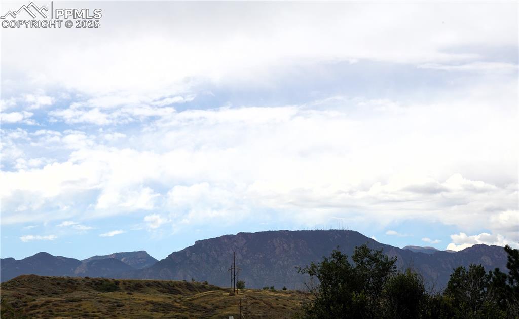 Image 5 of 38: Rocky mountain views from uppper level living room window