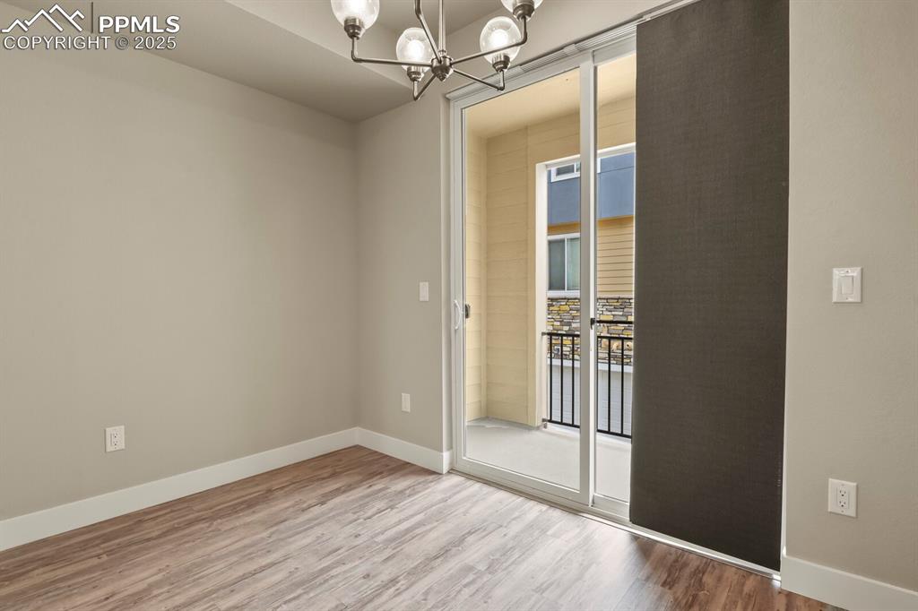 Image 13 of 29: Dining area with access to balcony