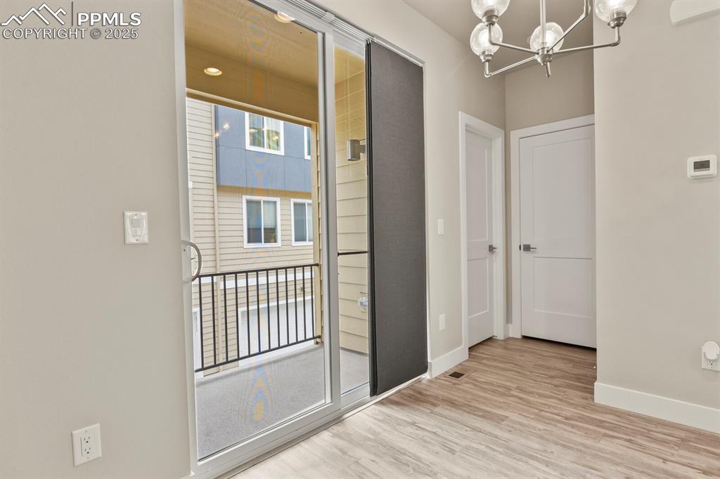 Image 14 of 29: Dining area with access to balcony