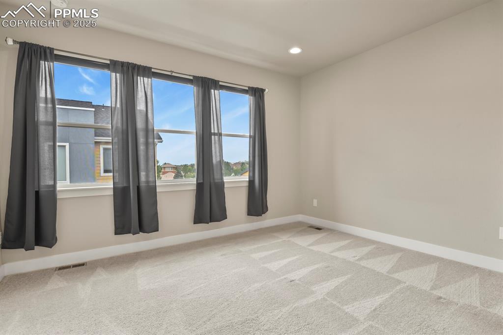 Image 17 of 29: Primary bedroom upper level with tons of natural light