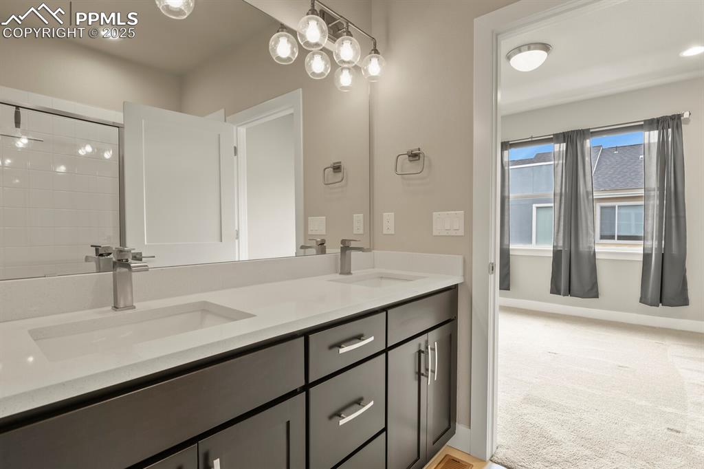 Image 19 of 29: Private primary 3/4 bathroom with double vanity