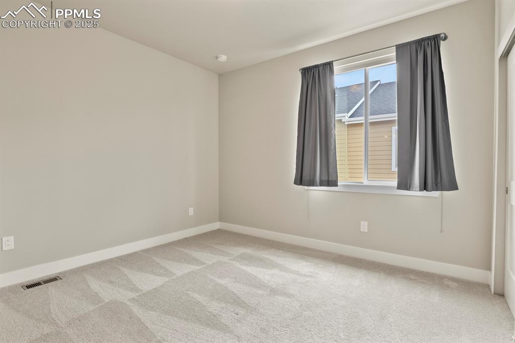 Image 21 of 29: 2nd bedroom on upper level